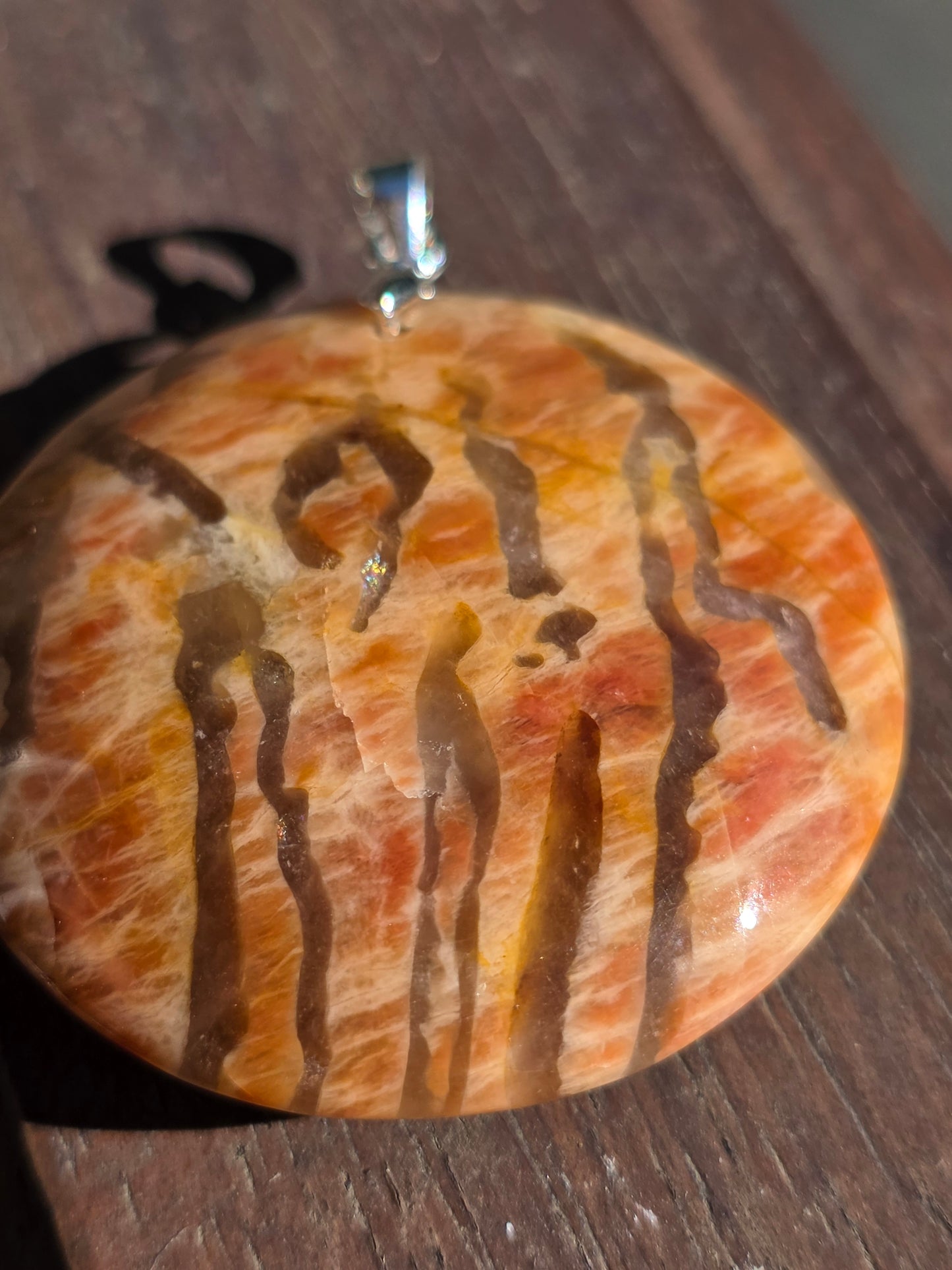 Pendentif pierre de lune orange et graphite