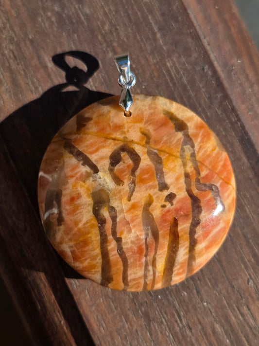 Pendentif pierre de lune orange et graphite