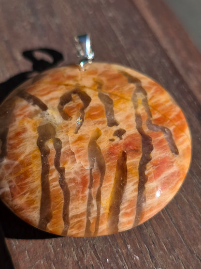 Pendentif pierre de lune orange et graphite