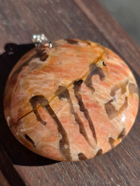Pendentif pierre de lune orange et graphite